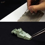 Tweezers adjust light green equidistant lines ruler piece for scale modeling