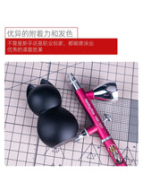 Pink and silver hobbymate hm-231 airbrush with a black cat-shaped paint cup for precision hobby tools in scale modeling