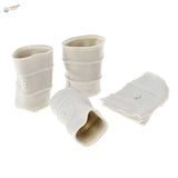 White ceramic miniature barrel planters with ribbed texture and small button-like details.