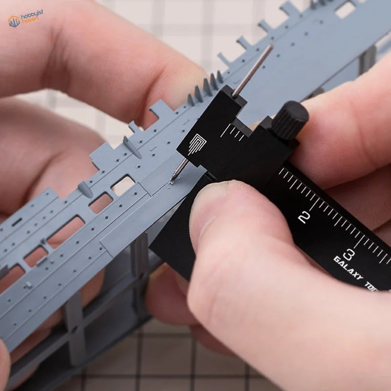 Black line carving tool measures gray Gundam model ship hull thickness