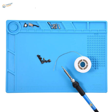 Blue silicone desk mat for soldering iron with molded compartments and grid