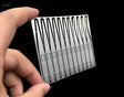 Silver metallic sheet with precision glue applicator cutouts for scale modeling tools