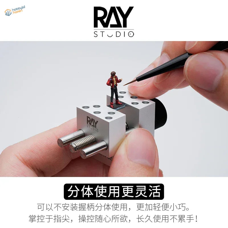 Miniature red black figure on silver ray clamp in precision handheld vise