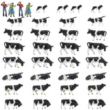 HO scale livestock farmers: black and white plastic cow figurines in various poses