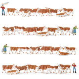 HO scale livestock farmers: brown and white plastic cow figurines in pastoral scenes