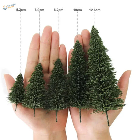 Five HO scale model trees with textured dark green surface and slender stem