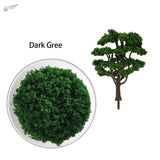 HO scale tree powder: dark green dense foliage in round container and assembled form for railroad scenery