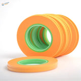 Orange and green adhesive rolls of hobby design ultra-thin modeling masking tape for precision hobby tools and scale modeling tools
