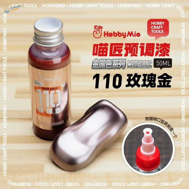 A 50ml hebbymio oil-based metallic rose gold paint bottle with silver cap for precision hobby tools and scale modeling