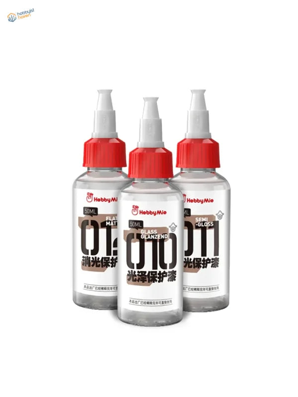 Three transparent glass bottles with red caps and white spray nozzles labeled hebbymie hobby mio 50ml pre-mixed varnishes for scale modeling tools