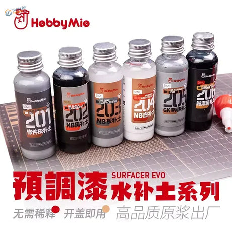 Six 50ml bottles of hobbymie surfacers evo model paint with metallic caps in gray black white and silver for precision hobby tools