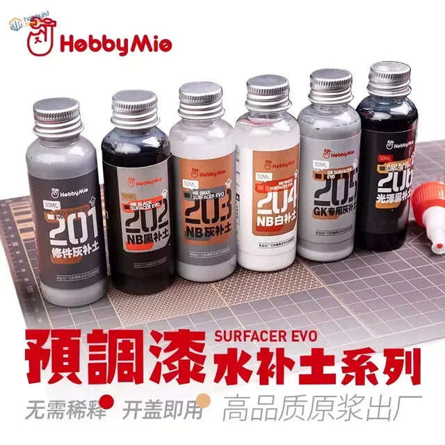 Six 50ml bottles of hobbymie surfacers evo model paint with metallic caps in gray black white and silver for precision hobby tools
