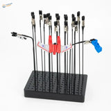 Holder with 20 magnetic alligator clips and red Transformers jet toy