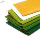 Stack of green, white, yellow felt sheets for landscape grass mat