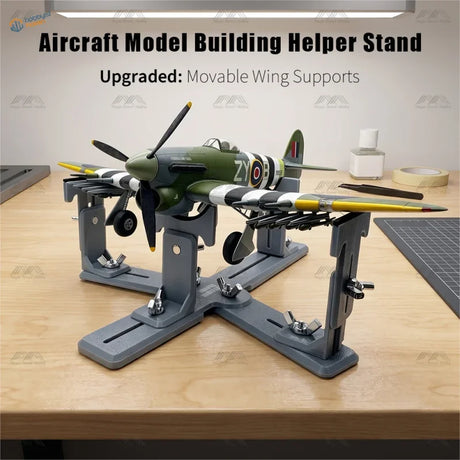 Leungs workshop upgraded model aircraft holder in gray metal displaying olive green and yellow aircraft with striped wings