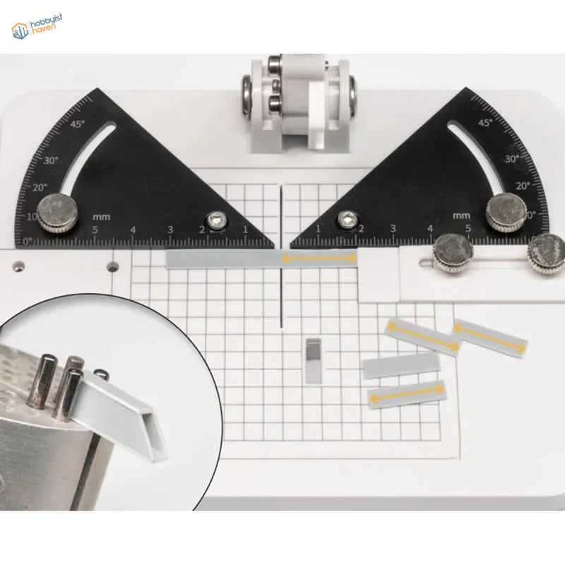 Liang angle cutting station with black triangular rulers on grid