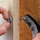 Magnetic fingertip holding silver hexagonal bolt on wood for scale modeling
