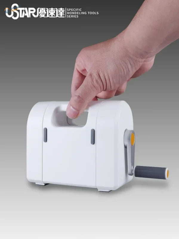 White plastic hand-cranked masking tape die cutting machine with gray handle