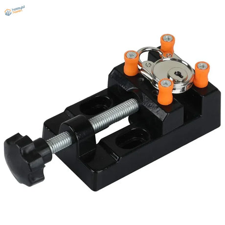 Mini table vise with black metal body, orange knobs and silver key lock