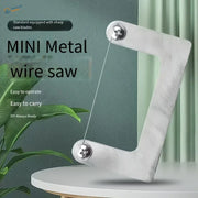Silver mini wire saw with sharp taut metal blade designed for scale modeling tools and model building tools