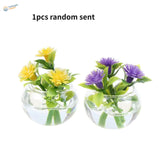 Exquisite miniature yellow purple flowers in glass vases for dioramas
