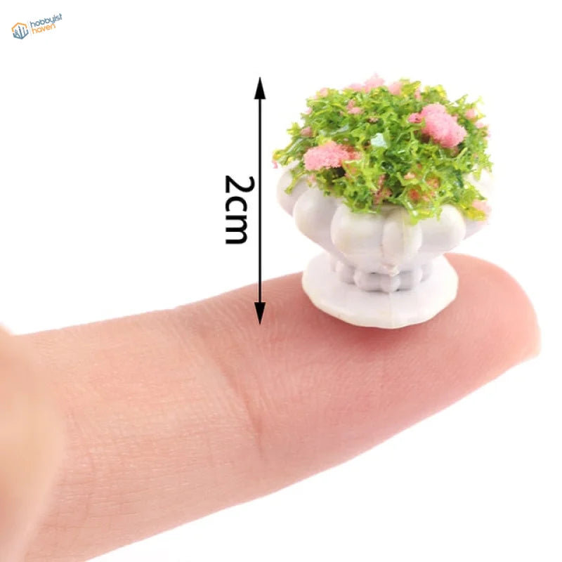 Exquisite miniature flowers in white fluted ceramic planter for dioramas