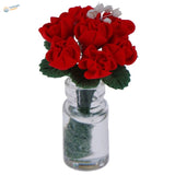 Exquisite miniature flowers: red roses in glass bottle for dioramas
