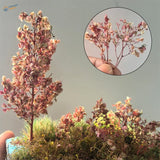 Miniature pink leaves dried flower arrangement resembling a tree