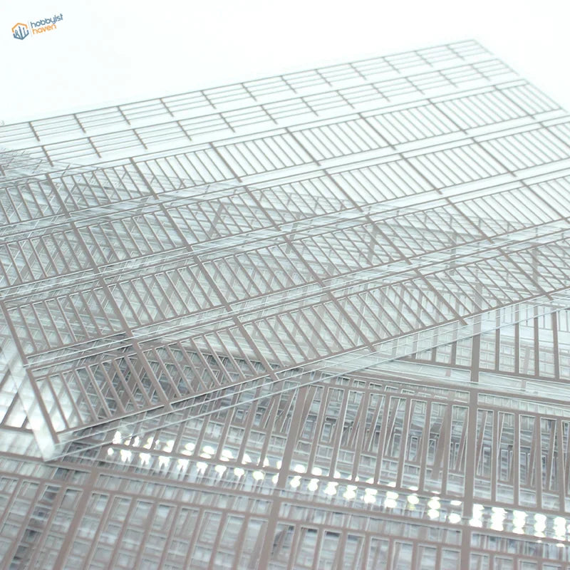 Transparent miniature railing in plastic cart with metal grid frame for scale modeling