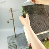 Miniature resin vine model with tiled roof and green moss edge