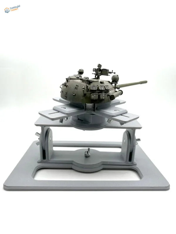 Model AFV holder with olive-drab tank model on gray stand
