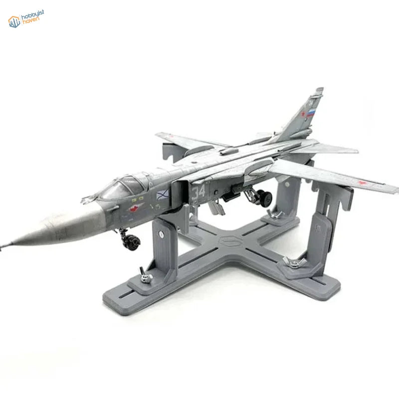 Gray Su-24 model aircraft on matching holder stand with markings