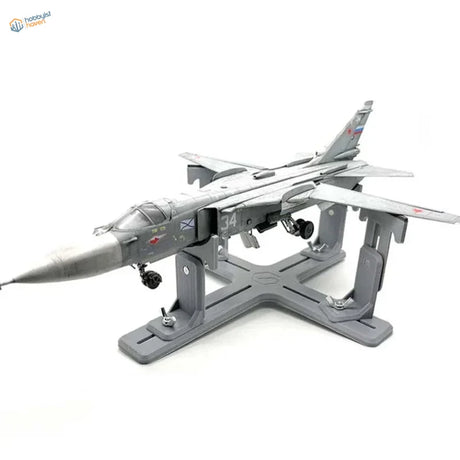 Gray Su-24 model aircraft on matching holder stand with markings
