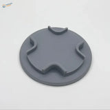 Gray circular plastic lid with notches for model aircraft holder