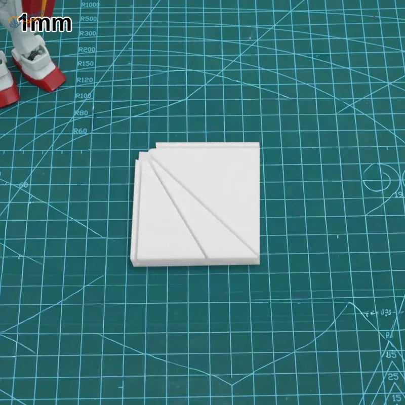White 1mm-thick plastic square pieces with diagonal grooves for multi-angle gluing jig used in scale modeling tools