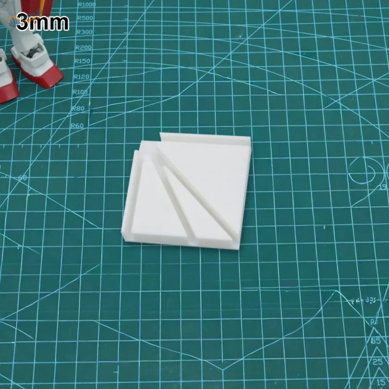 White 3mm thick plastic gluing jig part with triangular cutouts for precision scale modeling tools and model building tools