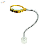 Gold-rimmed magnifying glass on multifunction soldering station gooseneck
