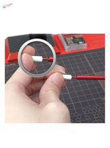 Red and white multipurpose wiping brush with silver ring component