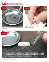Silver metal cleaning head on multipurpose wiping brush with white handle