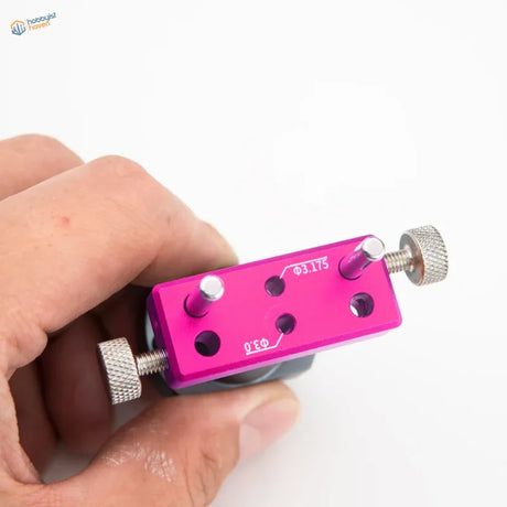 Vibrant pink perfect center locator with silver knobs and diameter markings