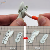 White Gundam arm parts before and after paint cleaning with pen