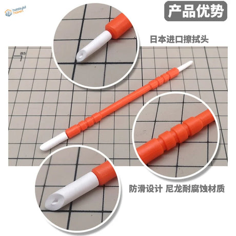 Orange and white paint cleaning pen with textured grip