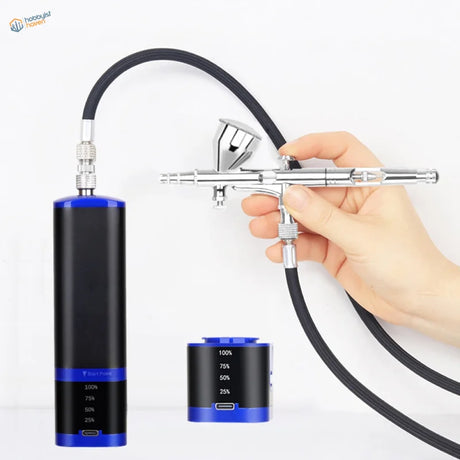 Portable cordless airbrush with silver sprayer, black hose, blue compressor