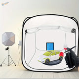 White and lime green tesla model y being painted inside a 30x30in portable spray booth with storage bag for scale modeling