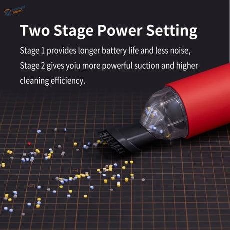 Red portable wireless vacuum cleaner with transparent dust chamber