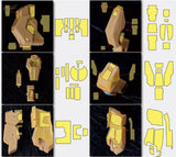 Tan plastic Gundam parts with yellow accents on Fortune Meows Studio masking tape sheets