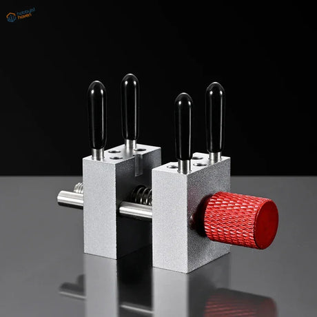Precision micro vise with silver aluminum jaws, black handles, red knob