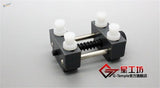 Precision mini vise black plastic watch winding tool with white knobs
