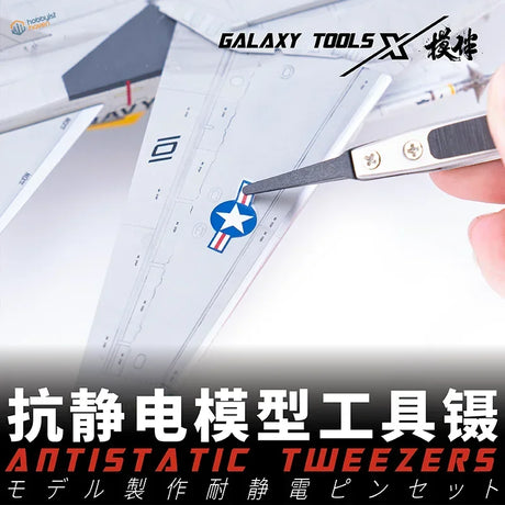 Pro-grade antistatic tweezers with replaceable chucks placing star insignia on model airplane wing
