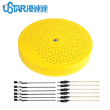 Back of bright yellow rotary painting turntable speaker with cables